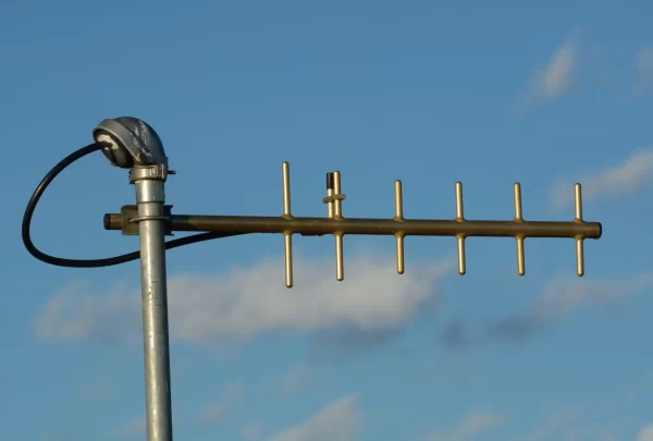 UHF yagi antenna used for digital telemetry data as late afternoon sun setting gives antenna a golden tone